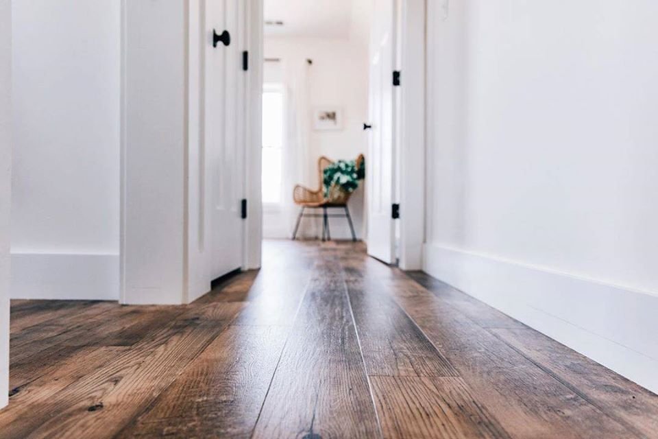 brown luxury vinyl floor for living room bought from Expressway Carpet in Mobile, AL